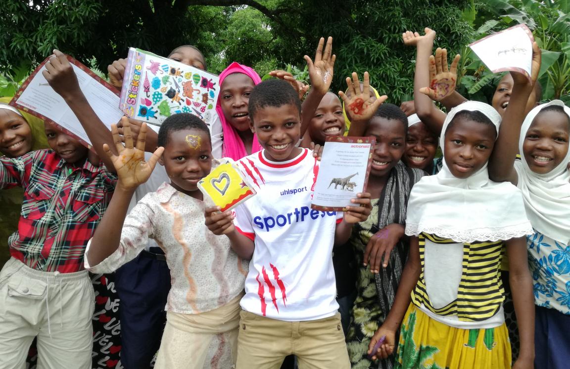 Children celebrating after message collection